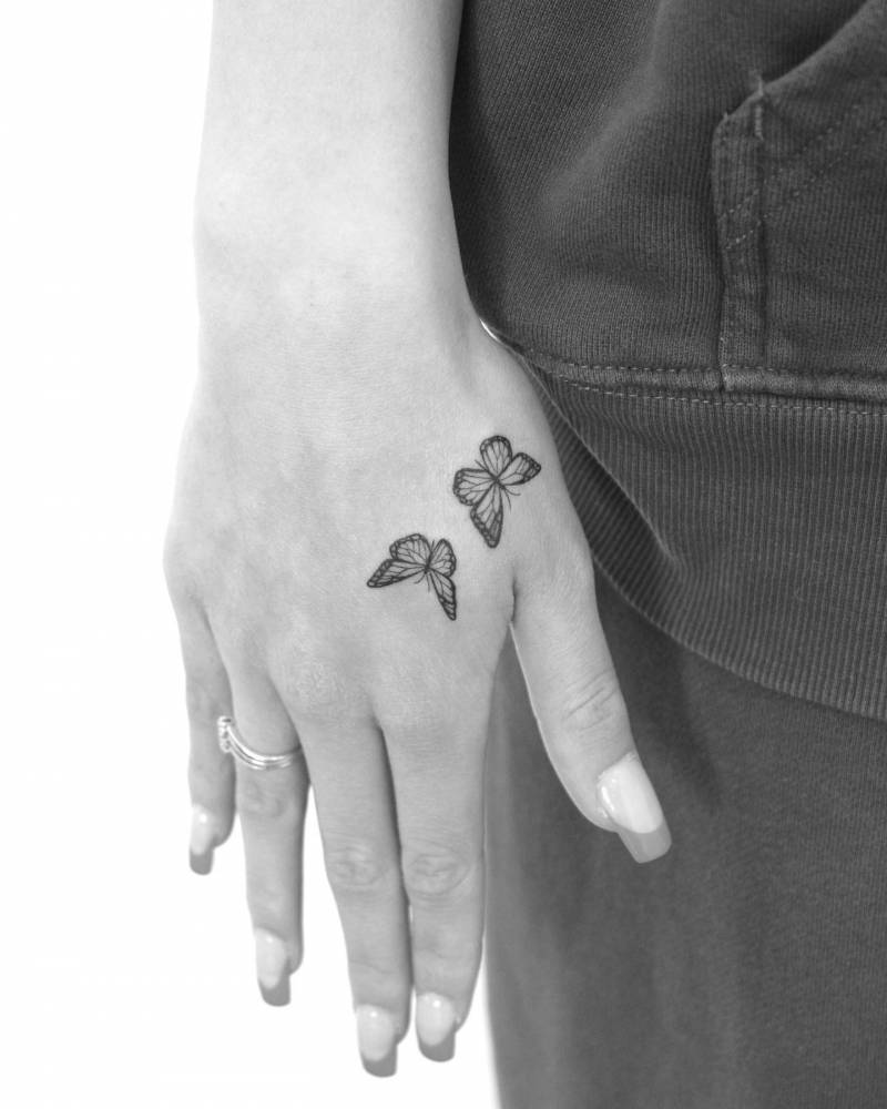 artistic small butterfly hand tattoo styles