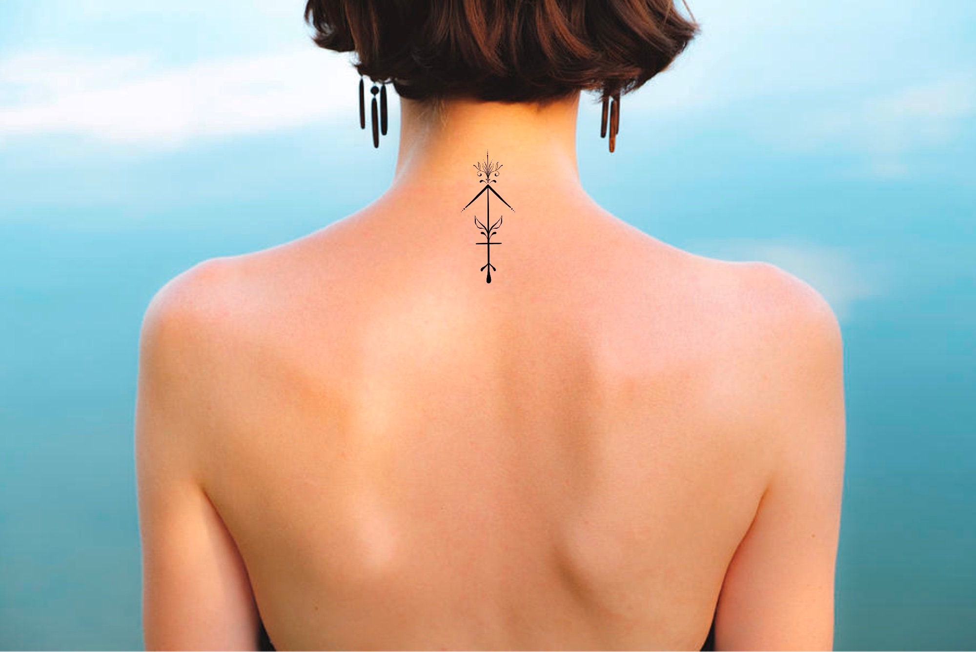 artistic small Sagittarius tattoos for women.