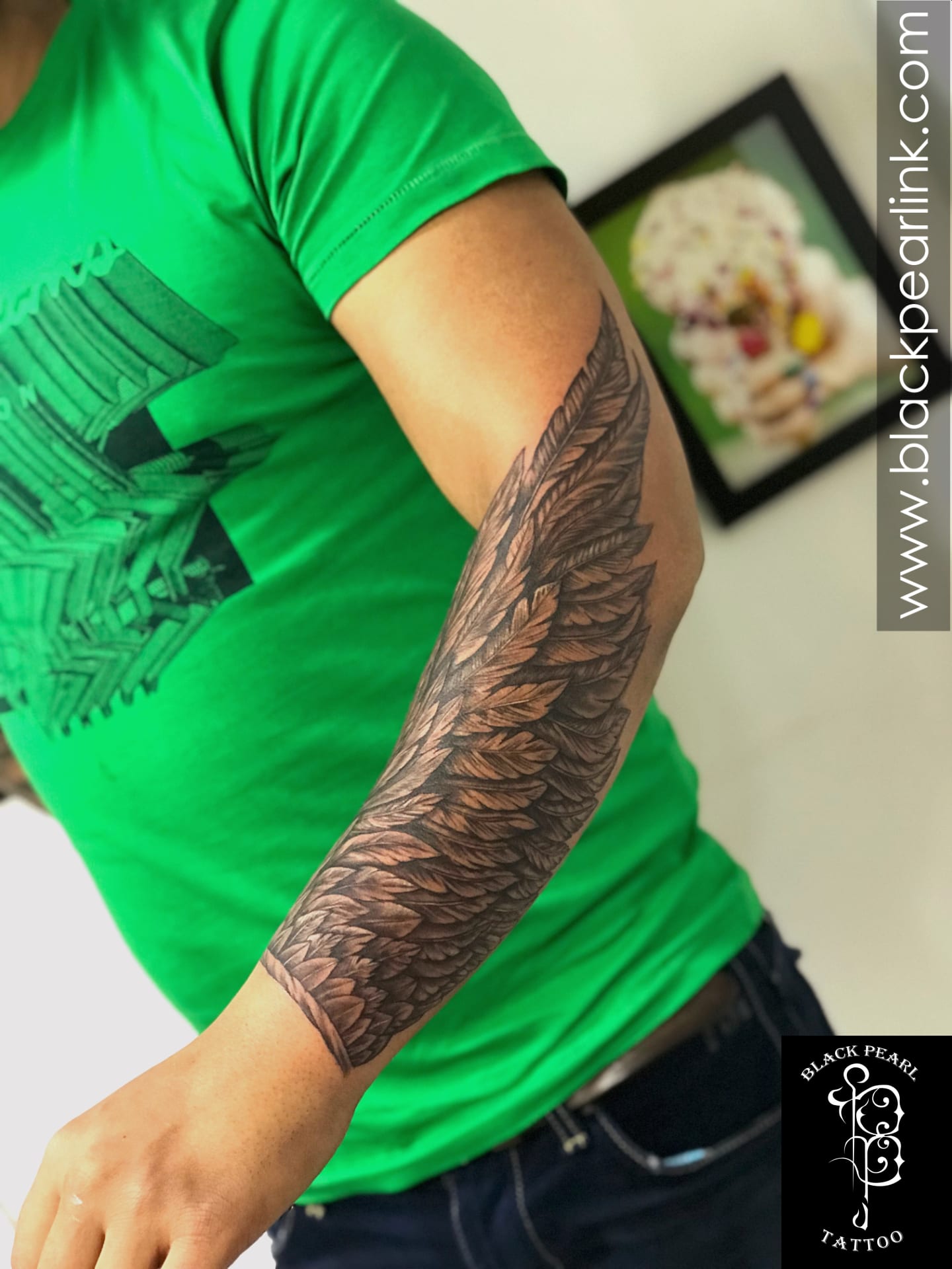 artistic small wing tattoo on forearm styles