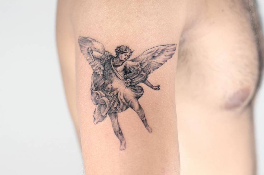 creative small St Michael tattoo placements for women