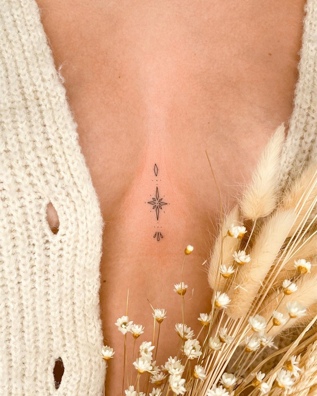 cute small sternum tattoo 0026