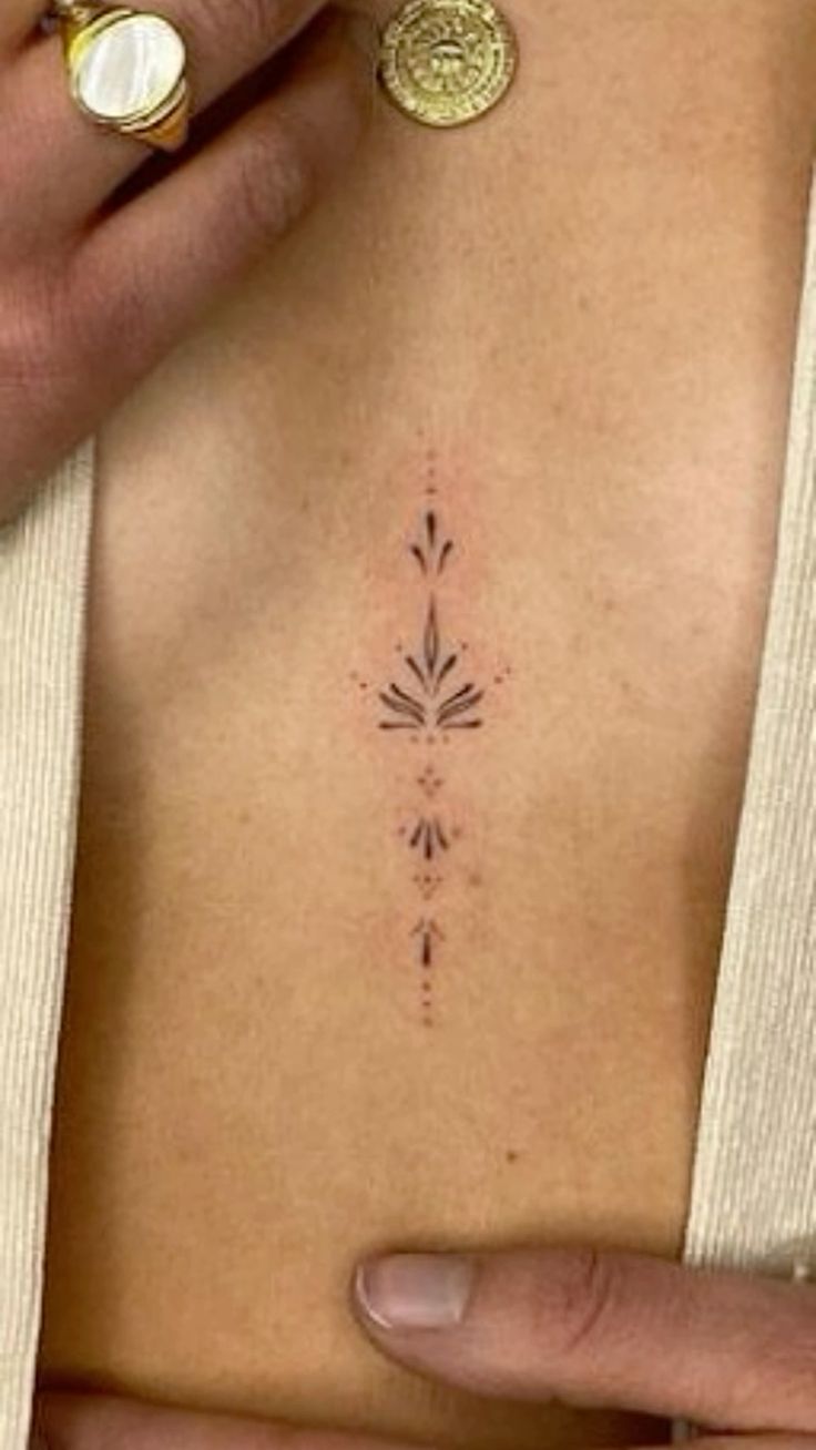 cute small sternum tattoo 0041