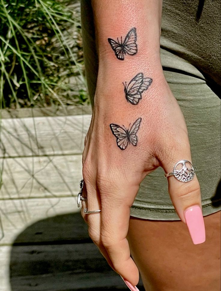 delicate butterfly hand tattoo designs