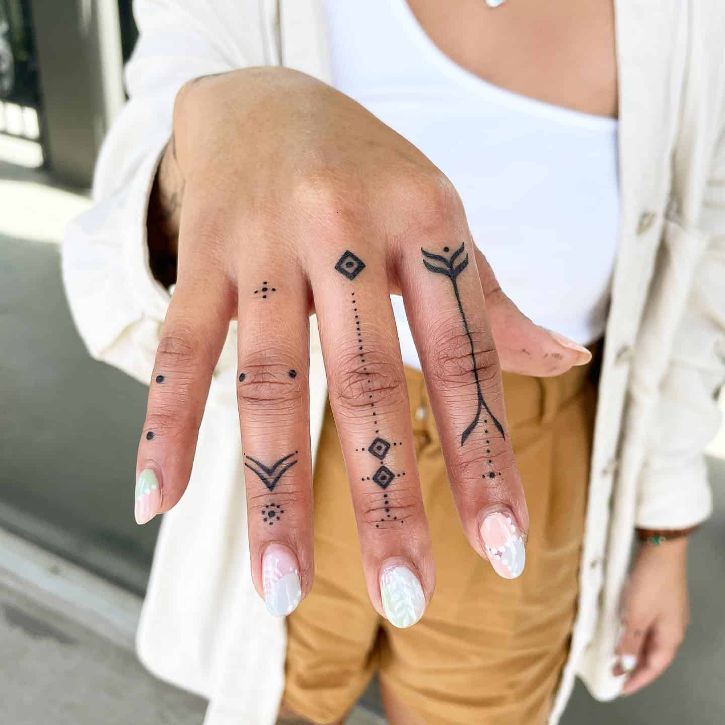 delicate finger tattoo concepts