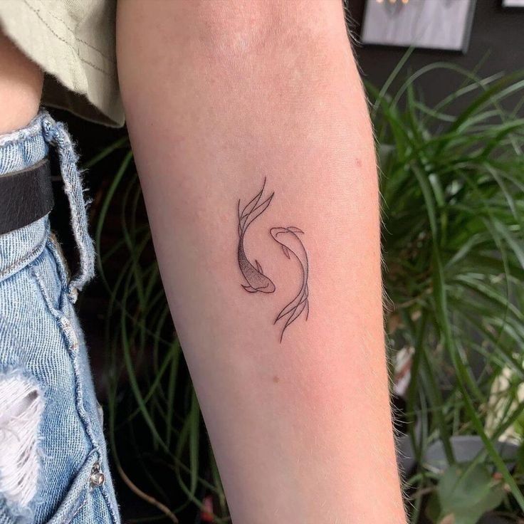 delicate minimalist small koi fish tattoo inspiration