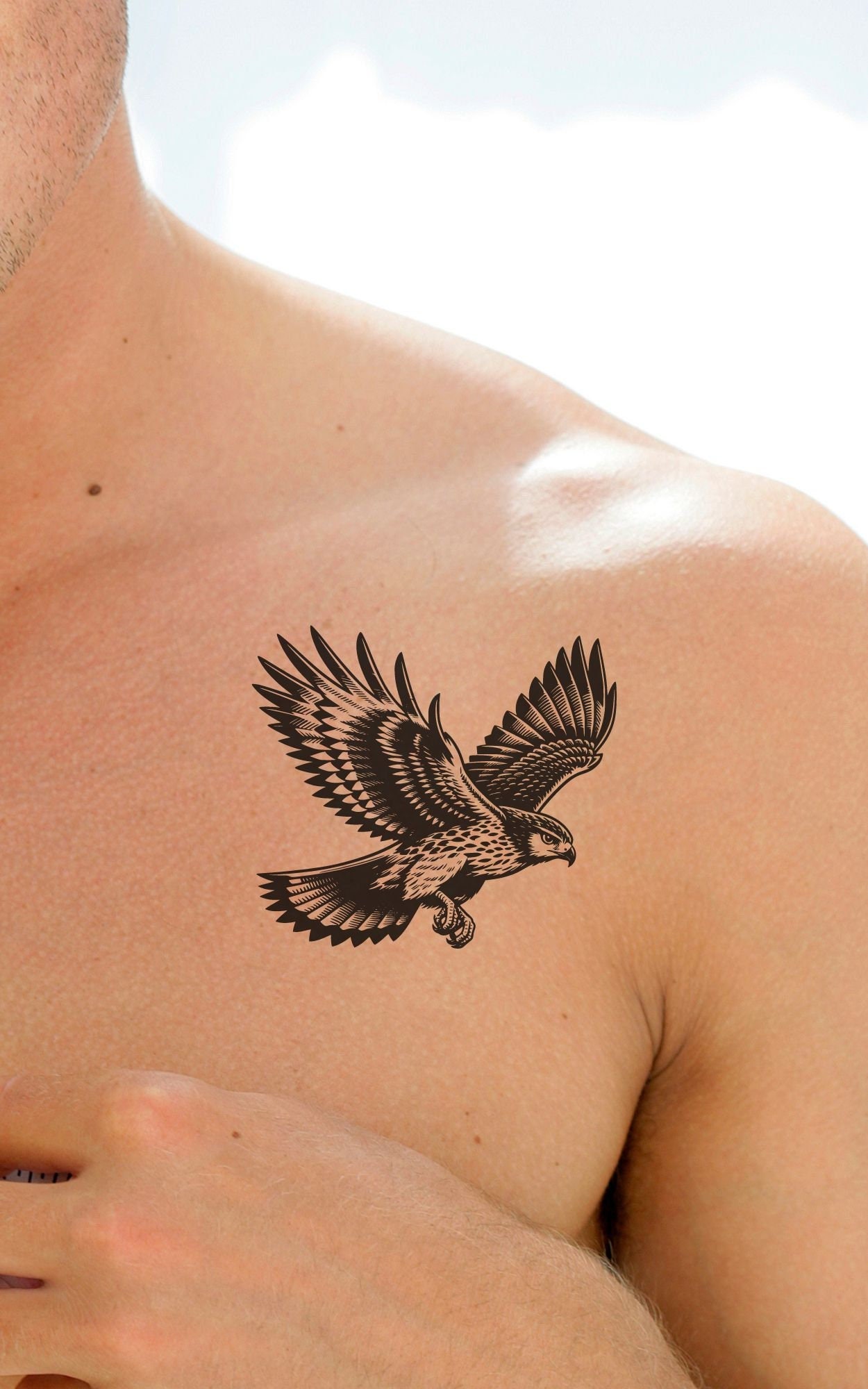 delicate small eagle chest tattoo meanings