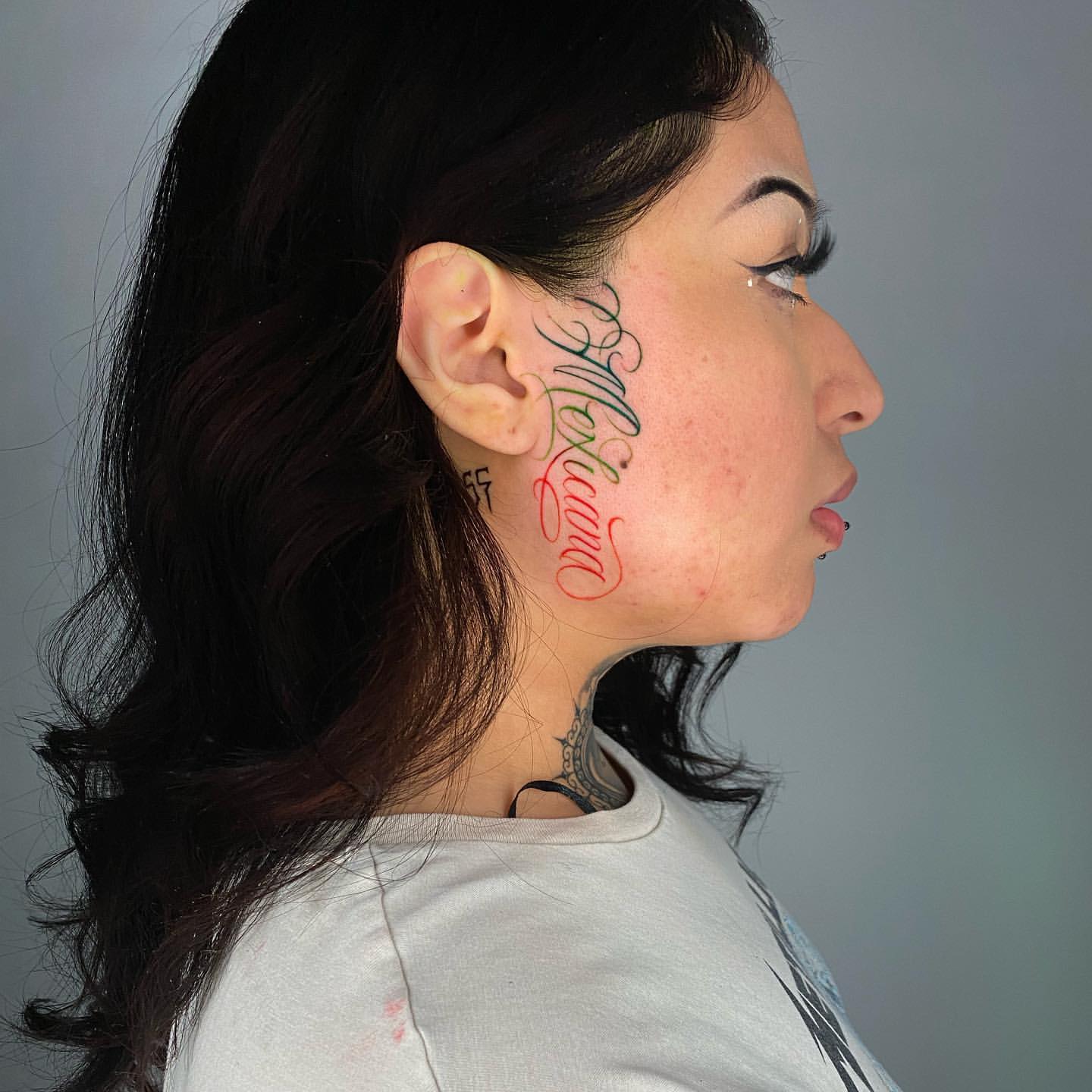 delicate small side face tattoo for women