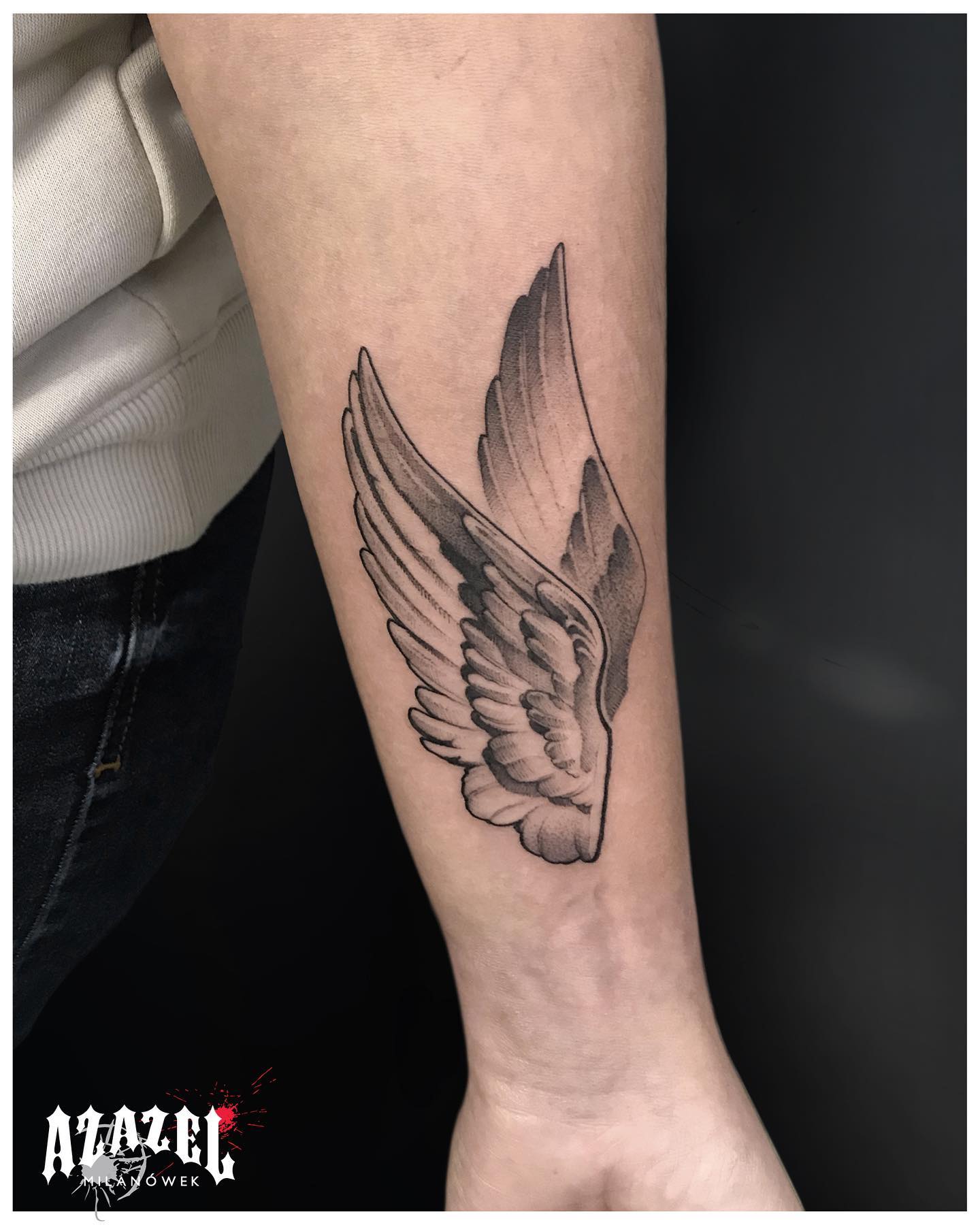 delicate small wing tattoo on forearm designs