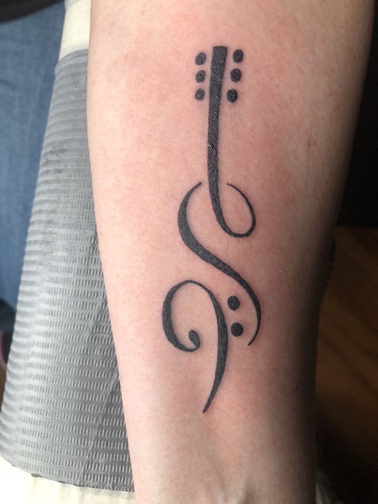 Delicate treble clef tattoo ideas.