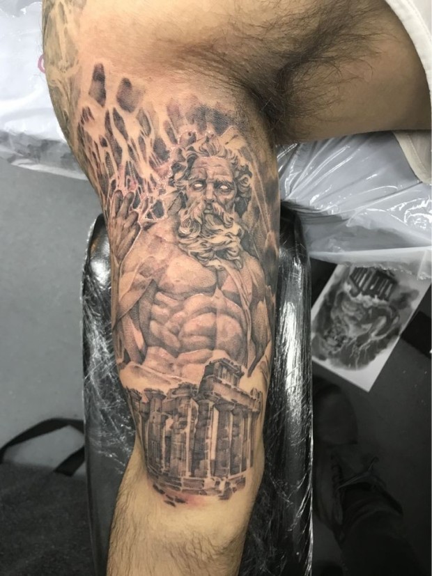 detailed Greek god tattoo imagery