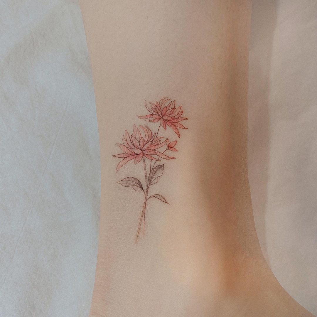 Elegant small chrysanthemum tattoo inspiration