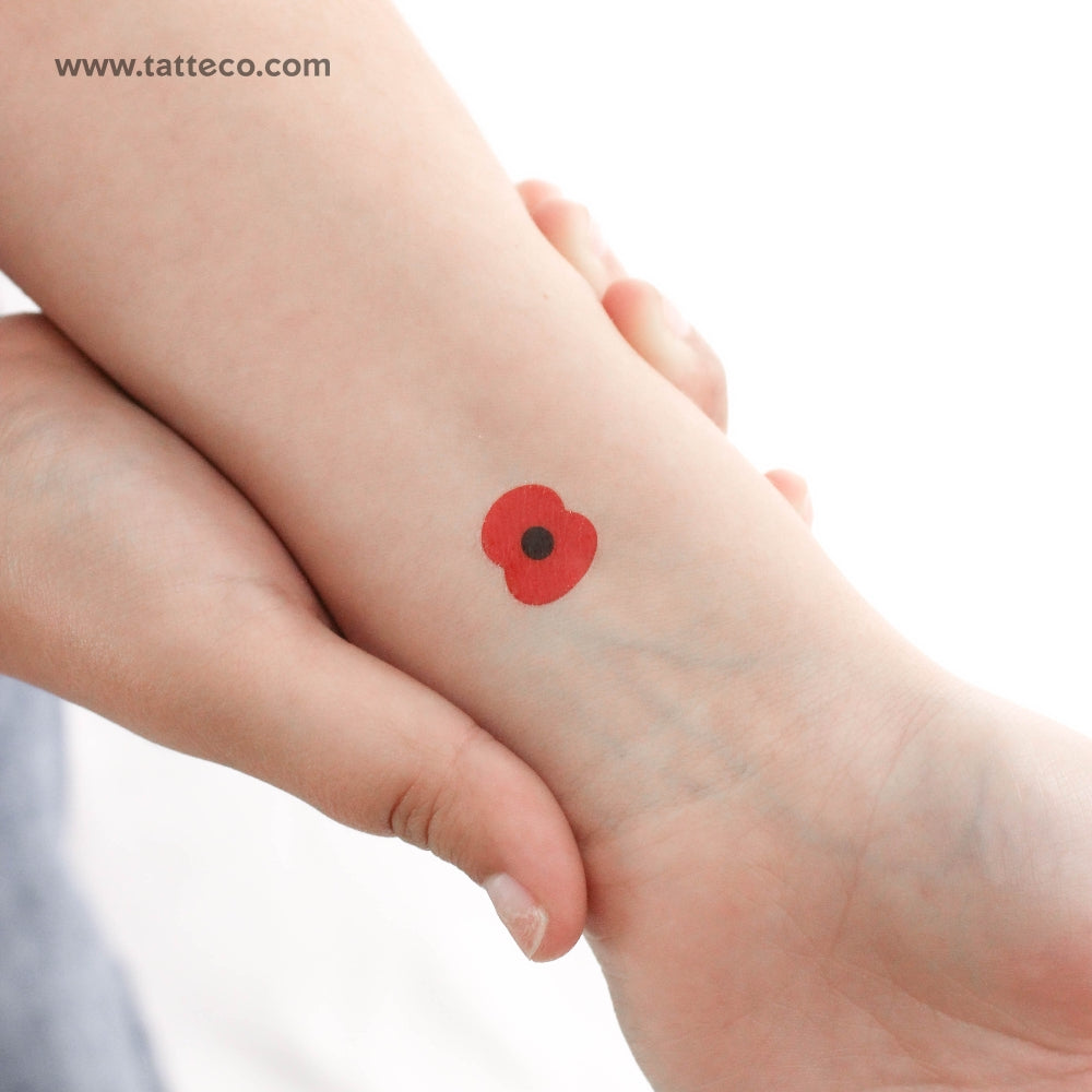 elegant small poppy tattoos on wrist