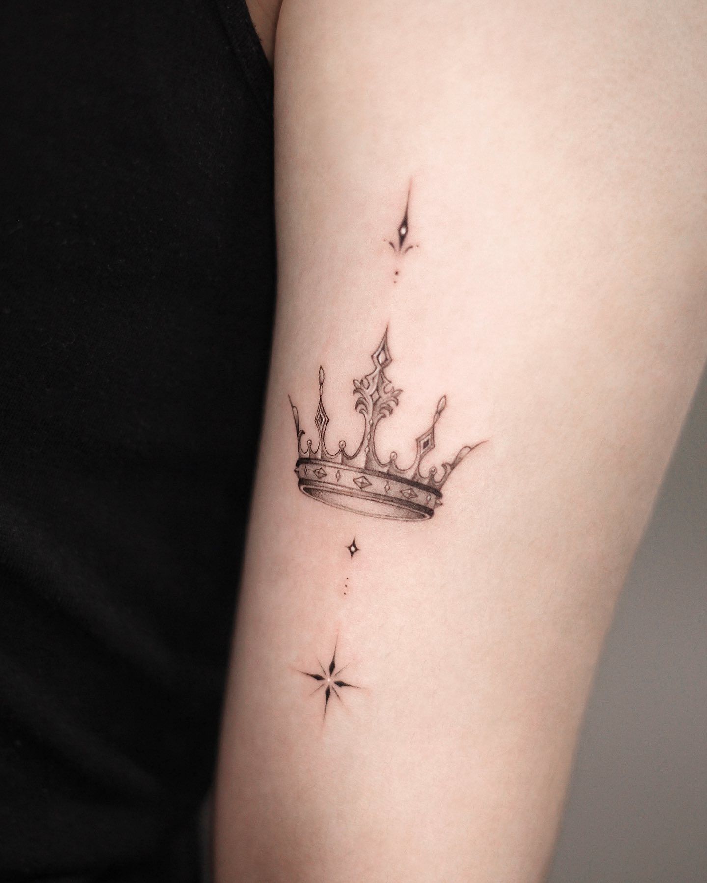 elegant small queen crown tattoo inspiration