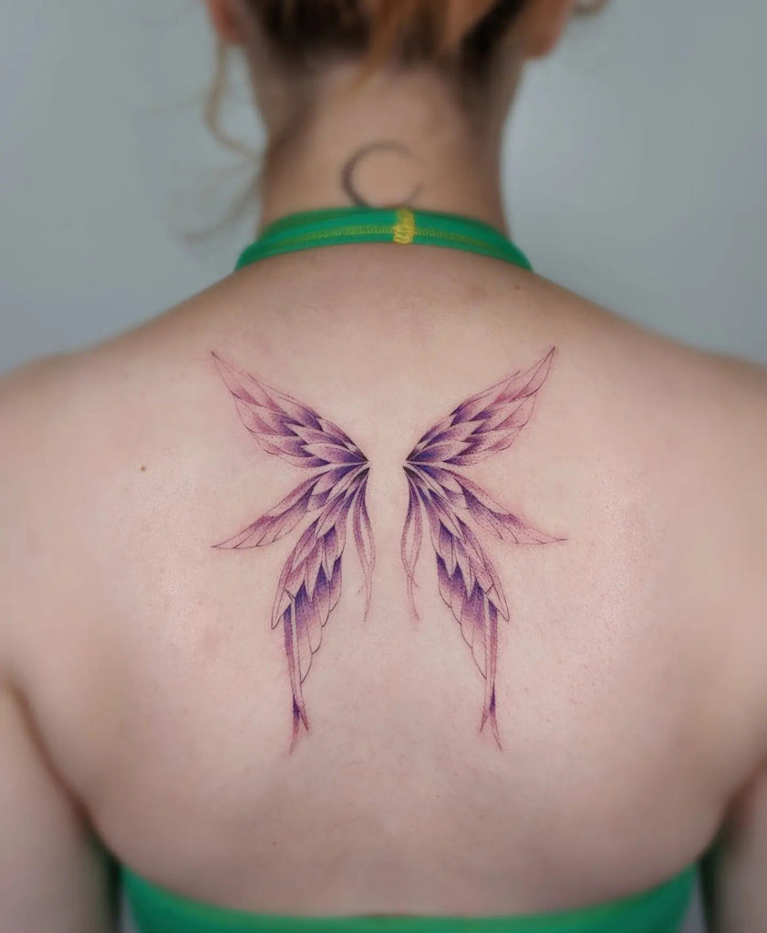 elegant small wing tattoo on forearm inspirations