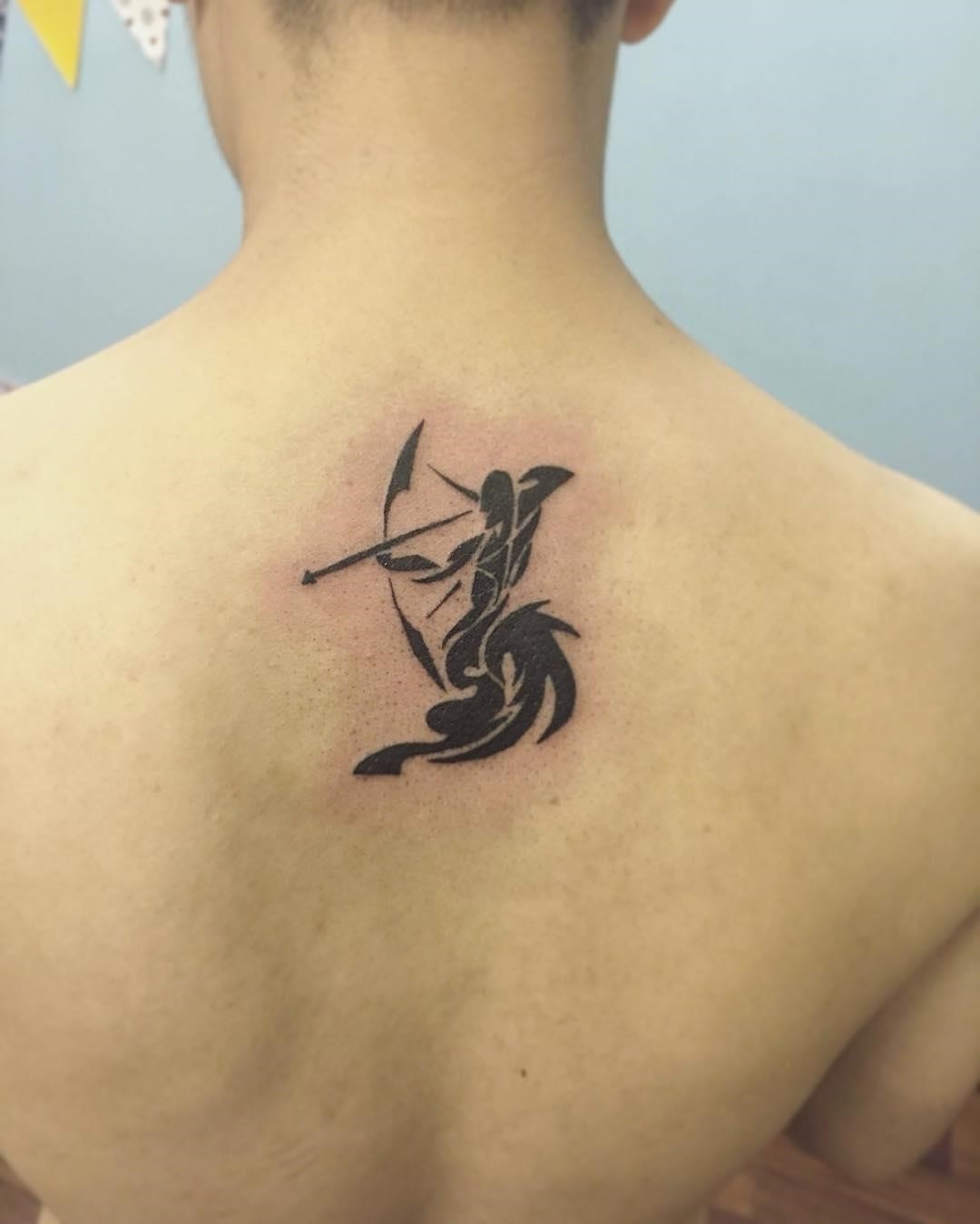 female small sagittarius tattoo 0060