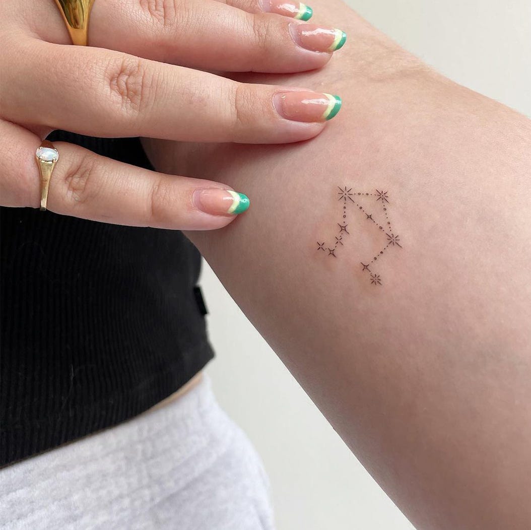 female small sagittarius tattoo 0099