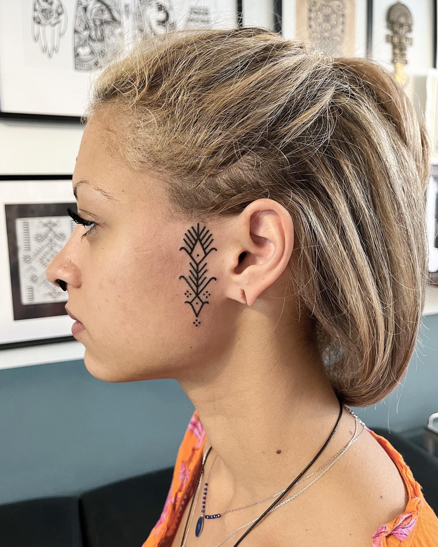 female small side face tattoo 0011