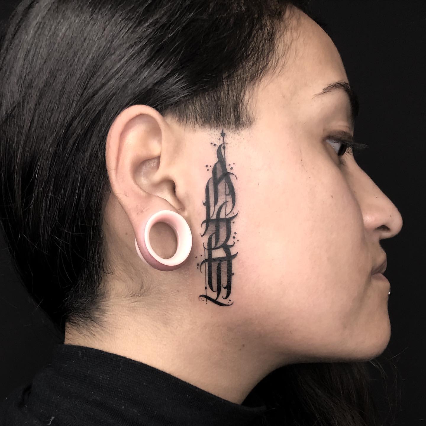 female small side face tattoo 0015