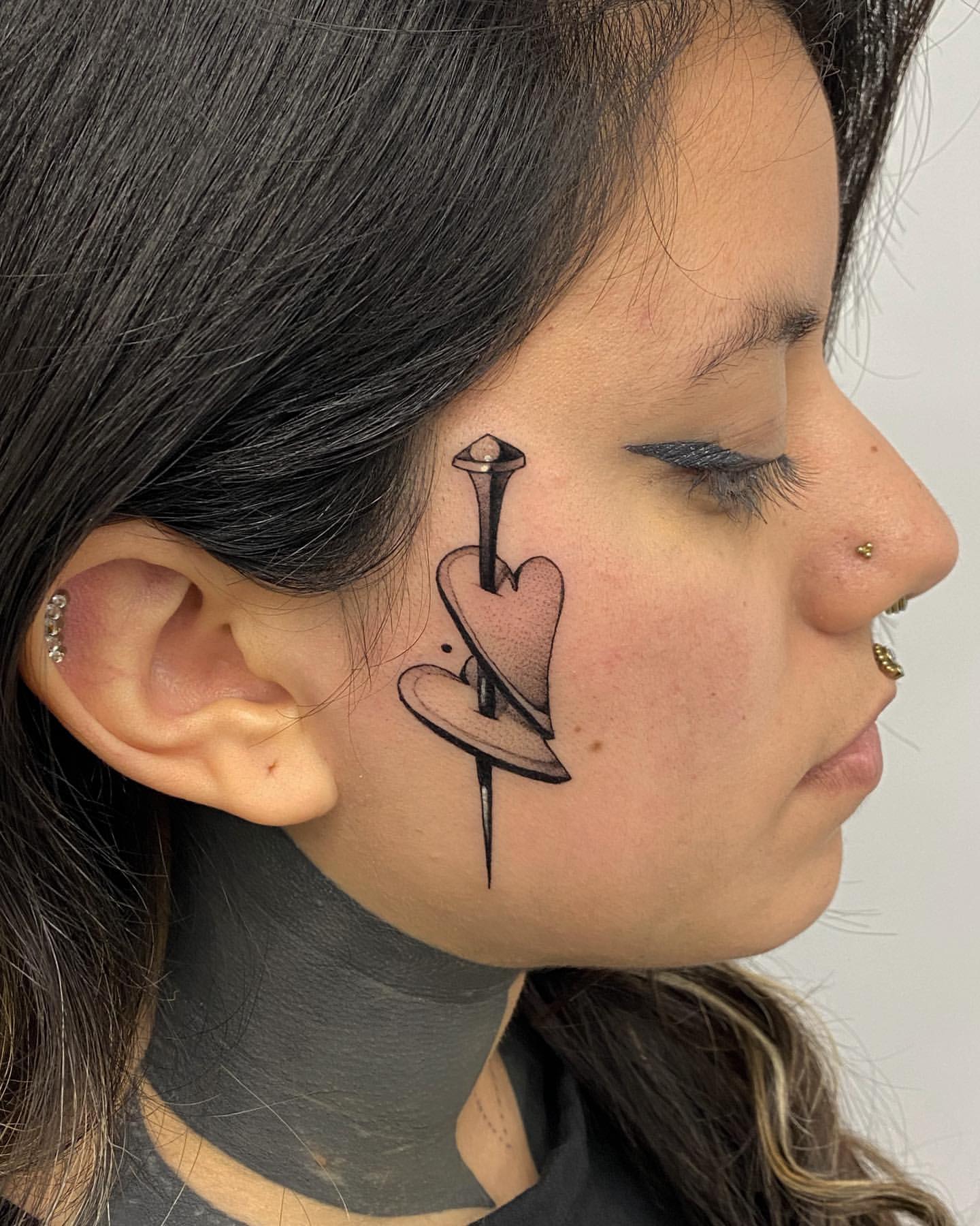 female small side face tattoo 0018