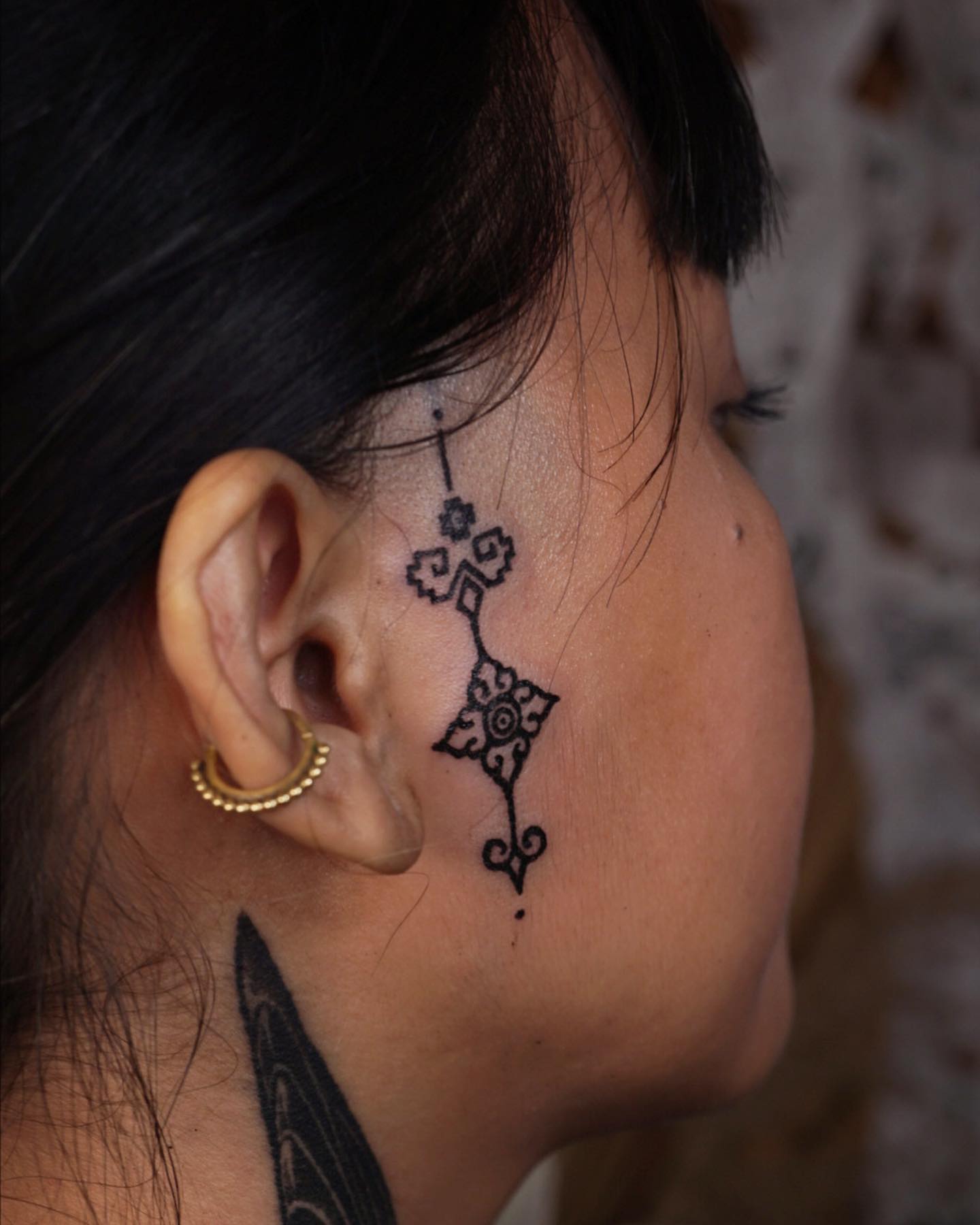 female small side face tattoo 0022