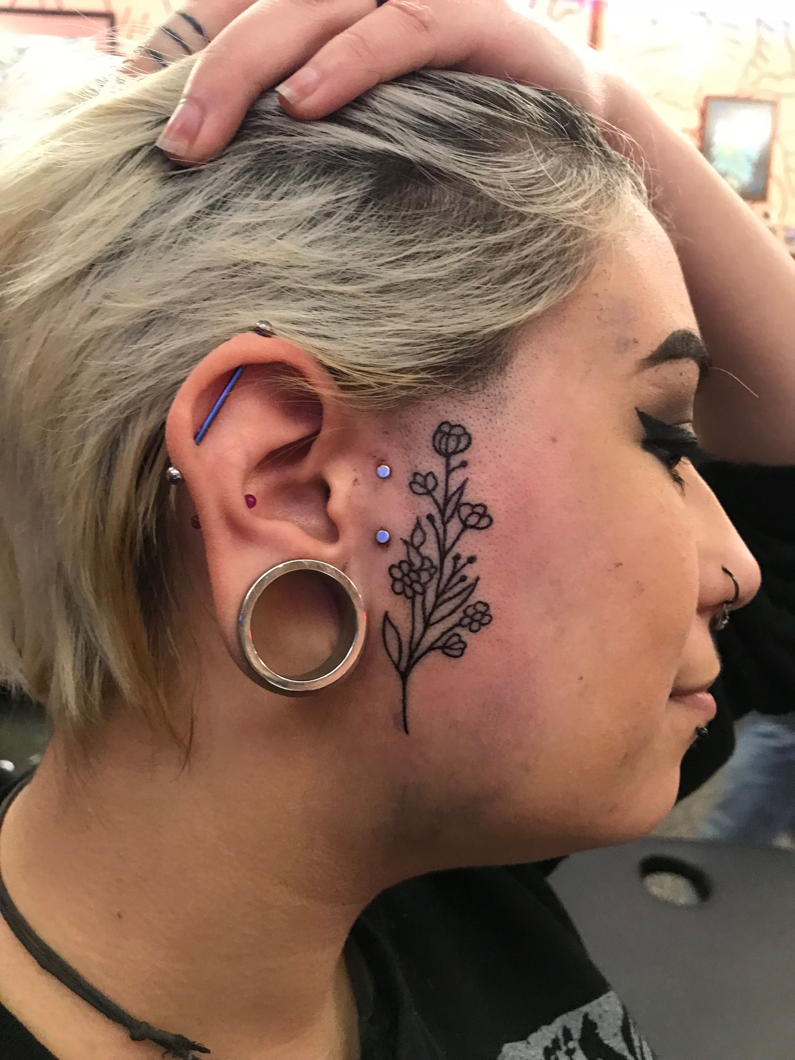 female small side face tattoo 0034