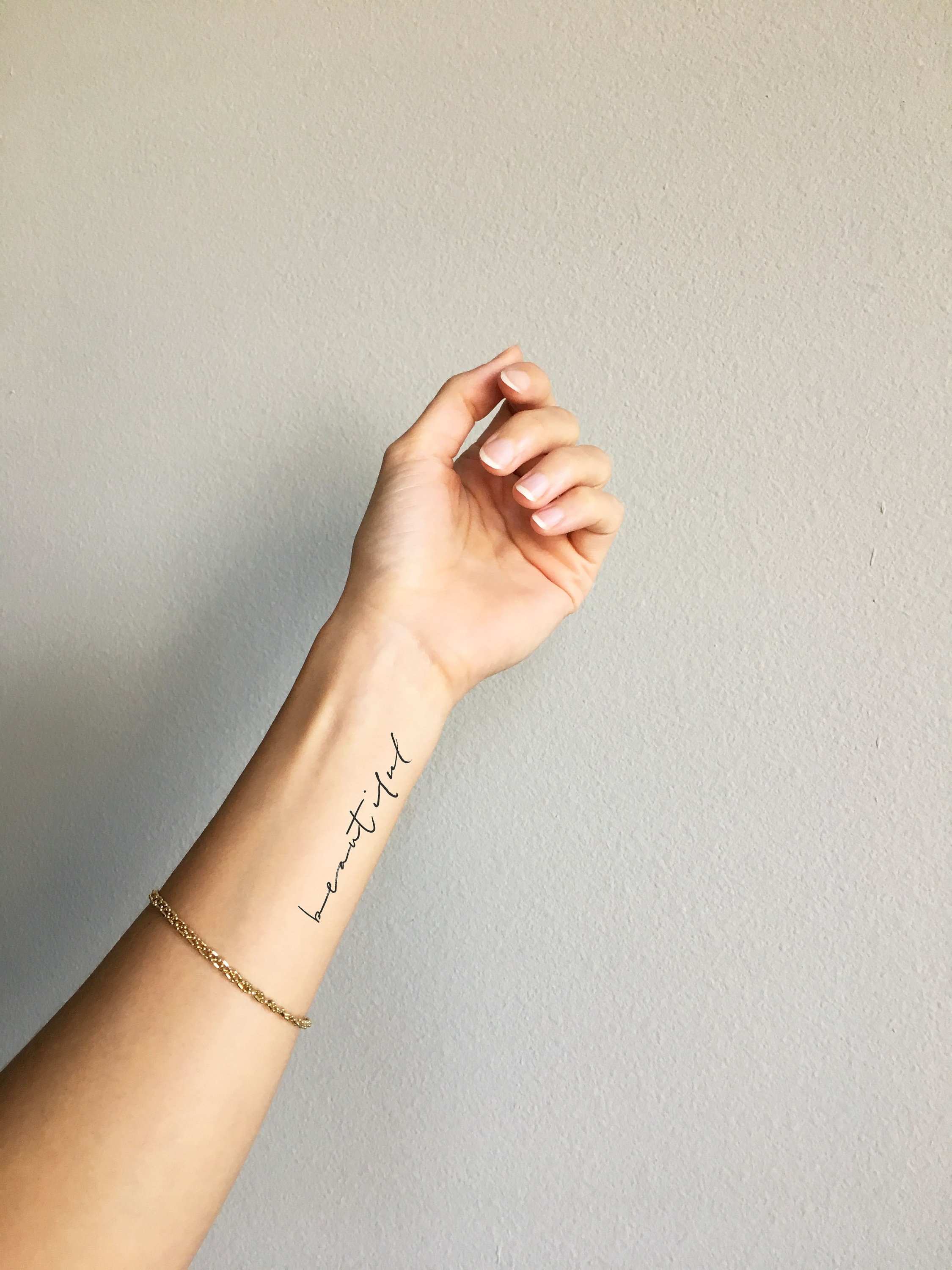 feminine small cursive tattoo 0073