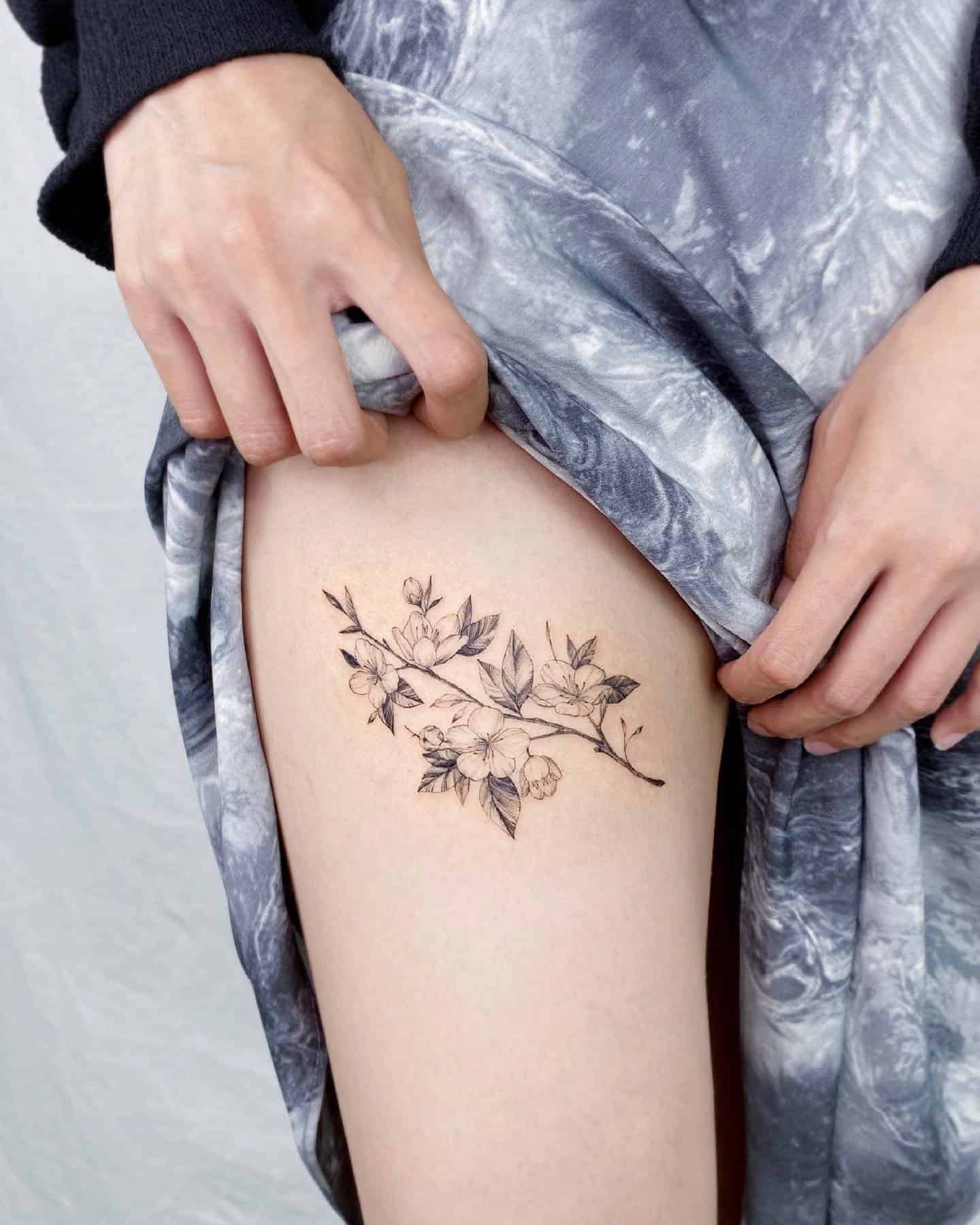 feminine upper thigh tattoo options