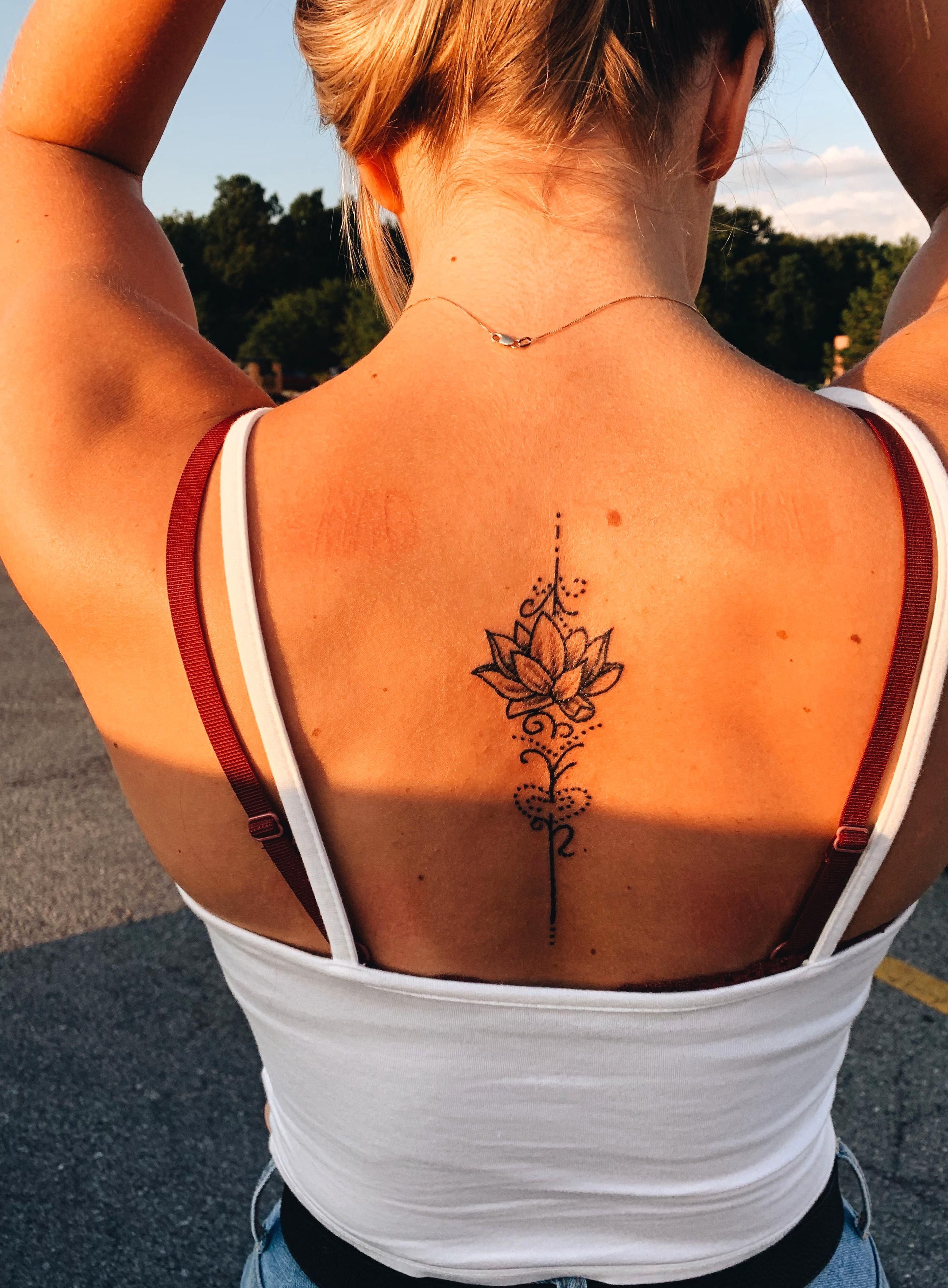 floral back tattoo ideas for women