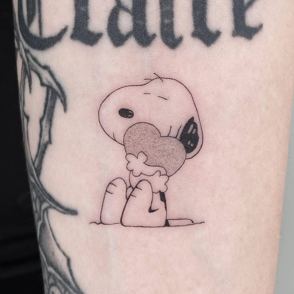 imaginative Snoopy tattoo illustrations.