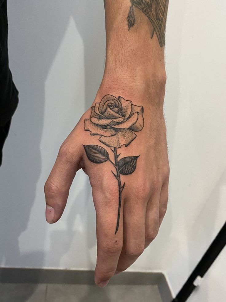 meaningful small rose tattoo designs for males.