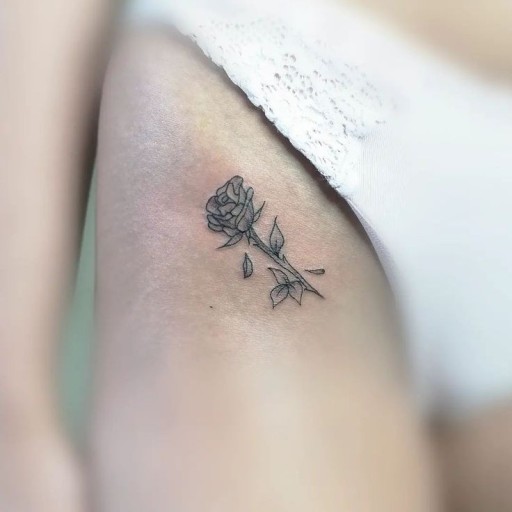 minimalist small black rose tattoo inspiration