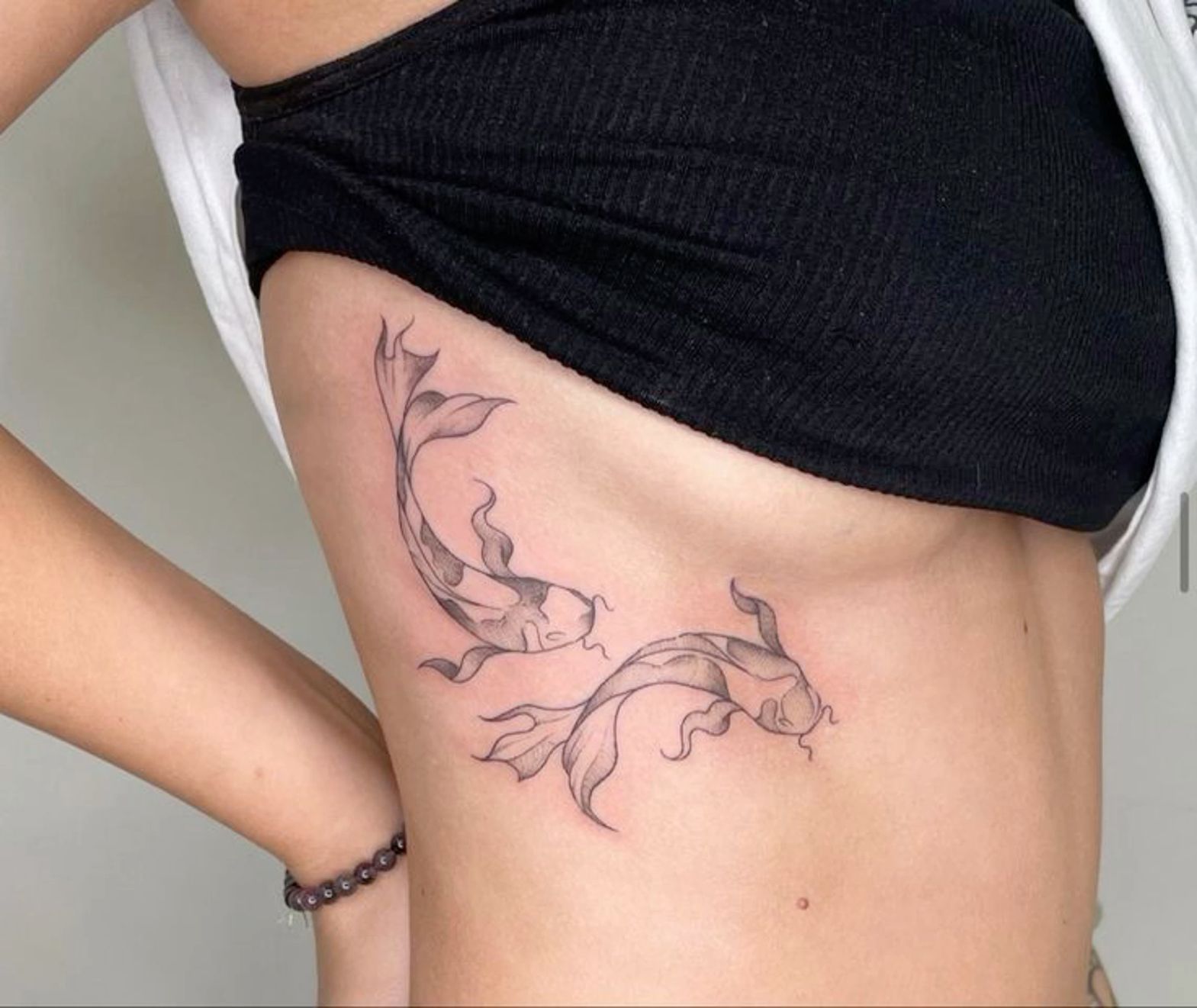 minimalist small koi fish tattoo 0079