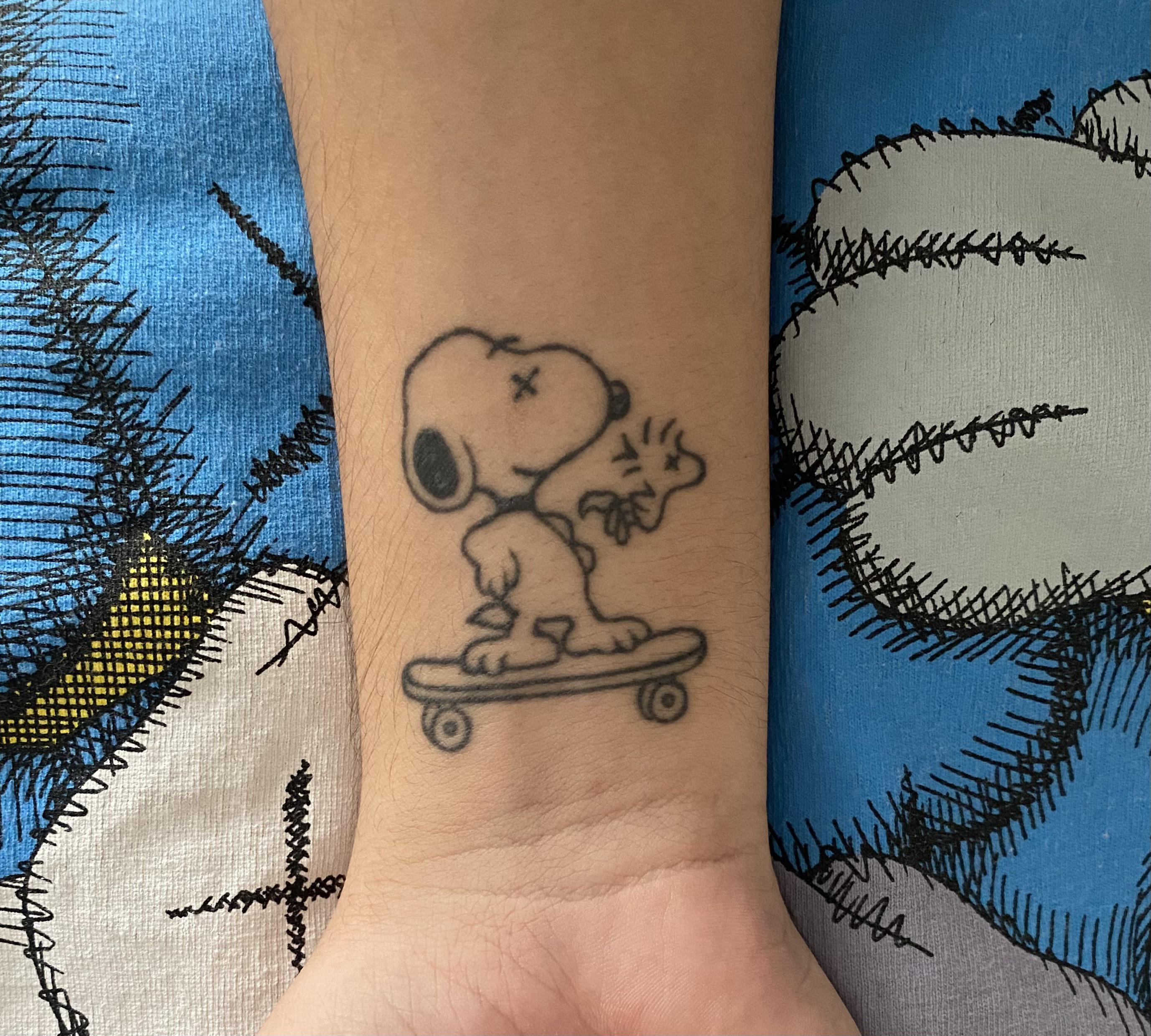 minimalist Snoopy tattoo styles