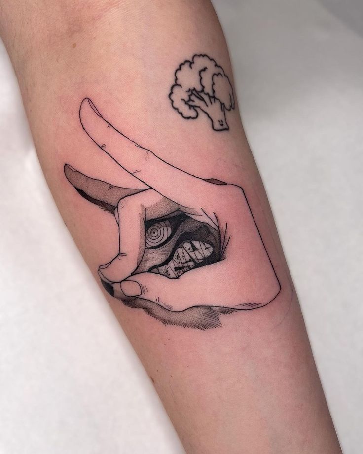 minimalistic anime hand tattoo designs