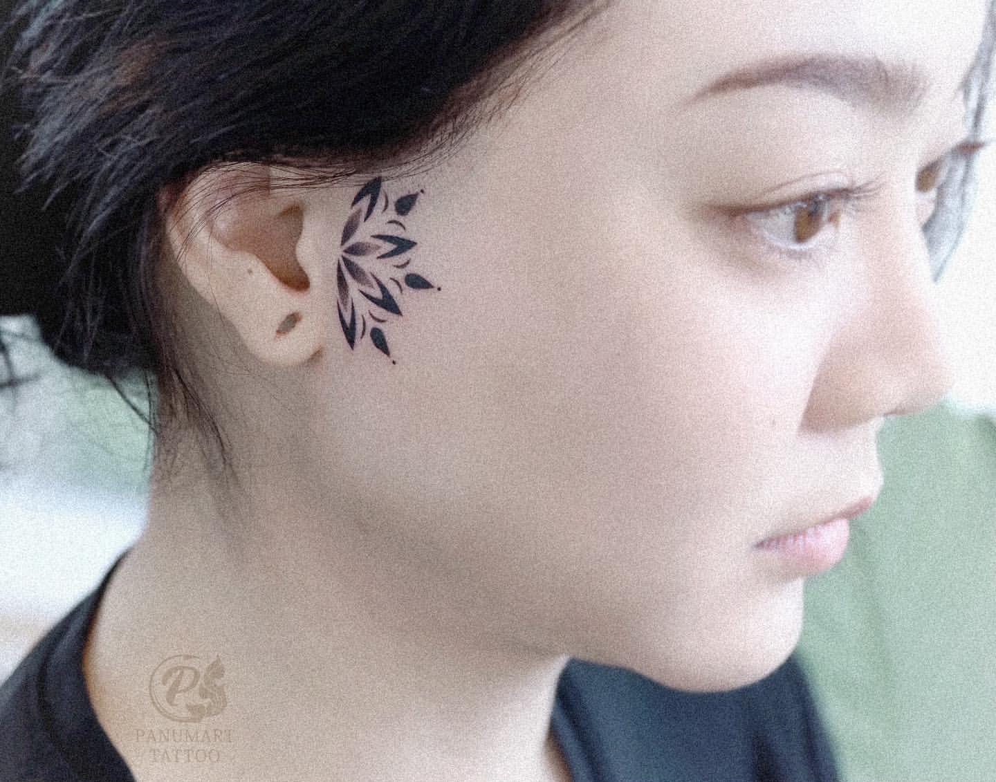 minimalistic female small side face tattoo designs