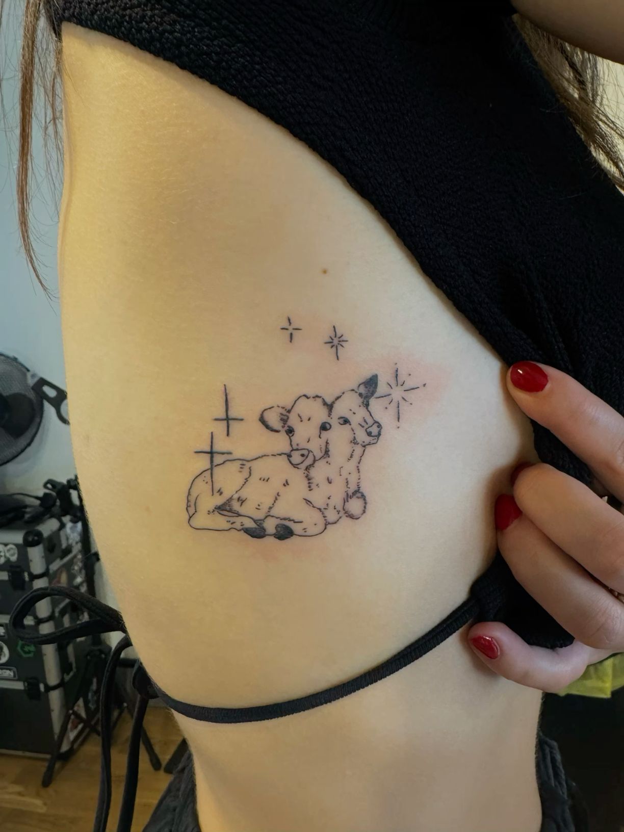 minimalistic small cow tattoo