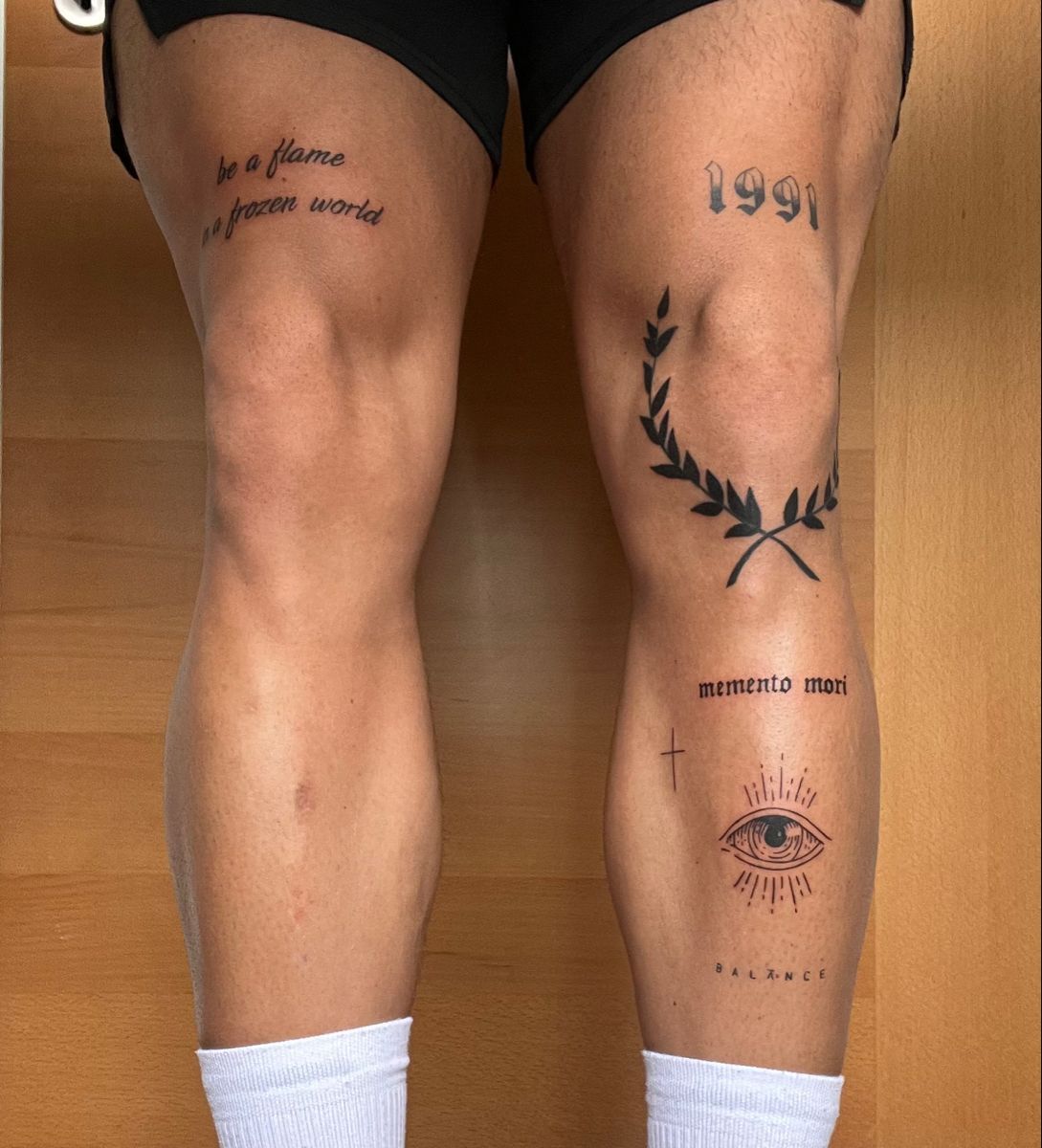 minimalistic small mens thigh tattoos