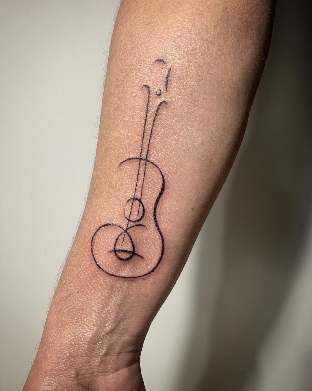 minimalistic tattoos for music enthusiasts