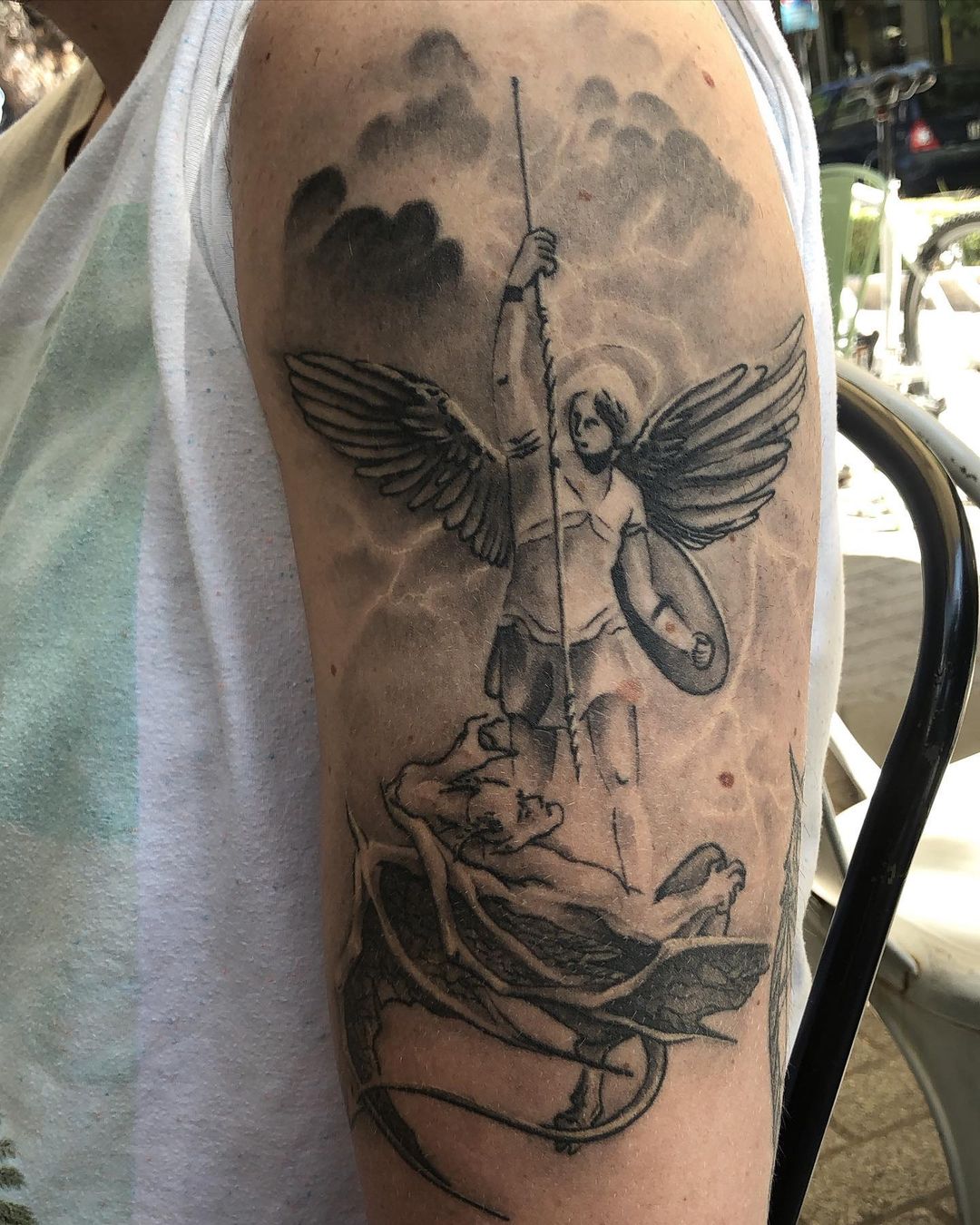 personalized small St Michael tattoo concepts for women.