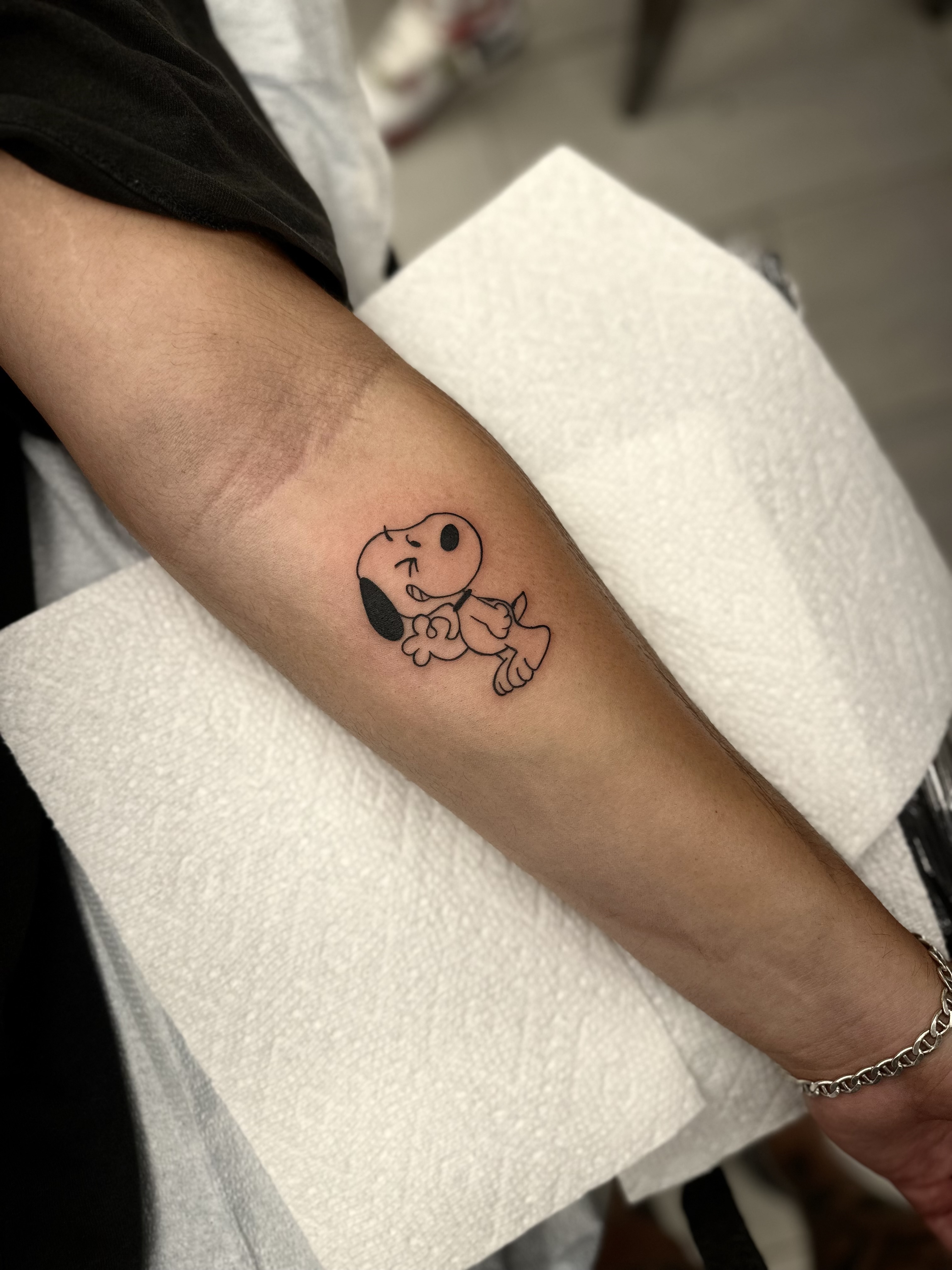 popular Snoopy tattoo themes