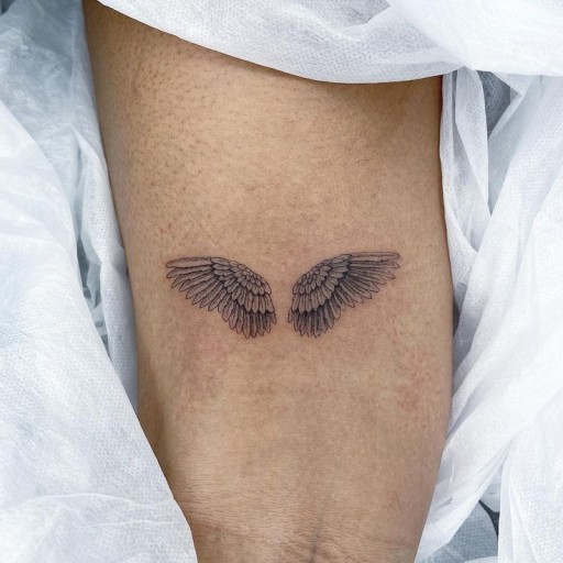 small angel wing tattoo