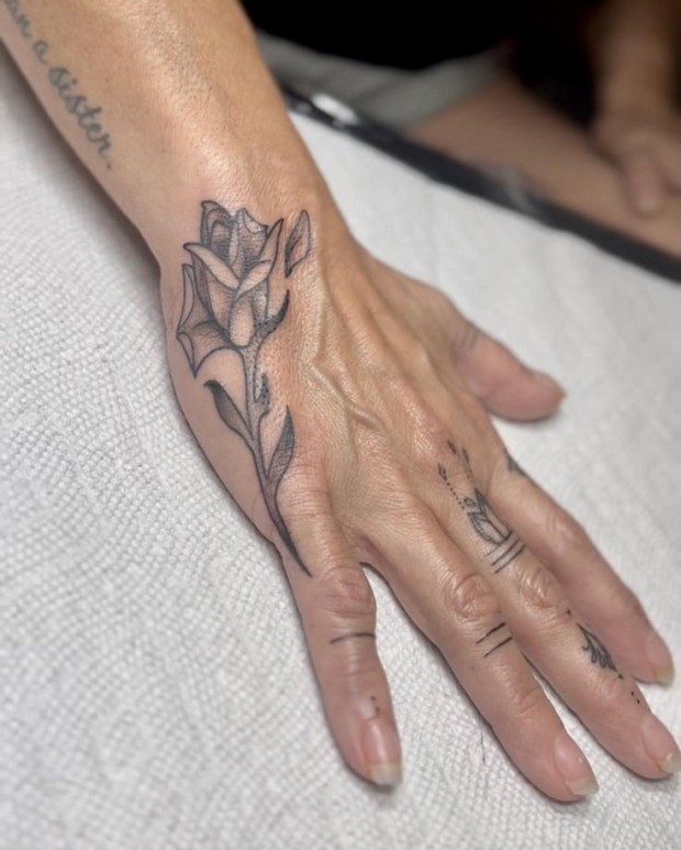 Small black rose tattoo 0019