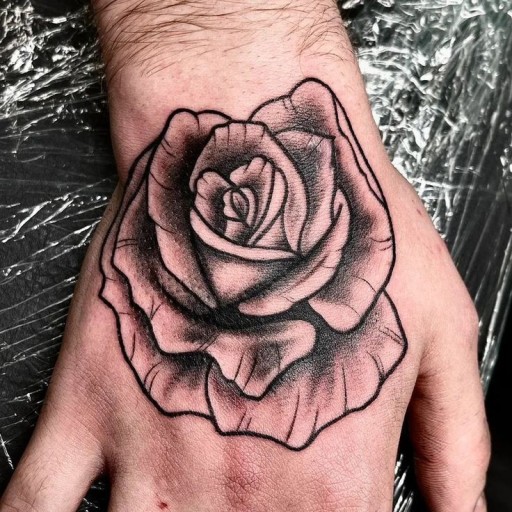 Small black rose tattoo 0030