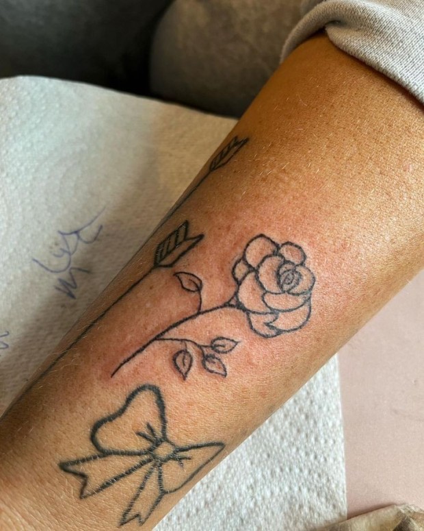 Small black rose tattoo 0047