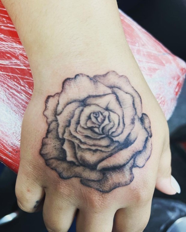 Small black rose tattoo 0051