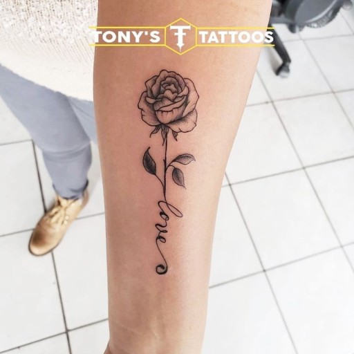 Small black rose tattoo 0058