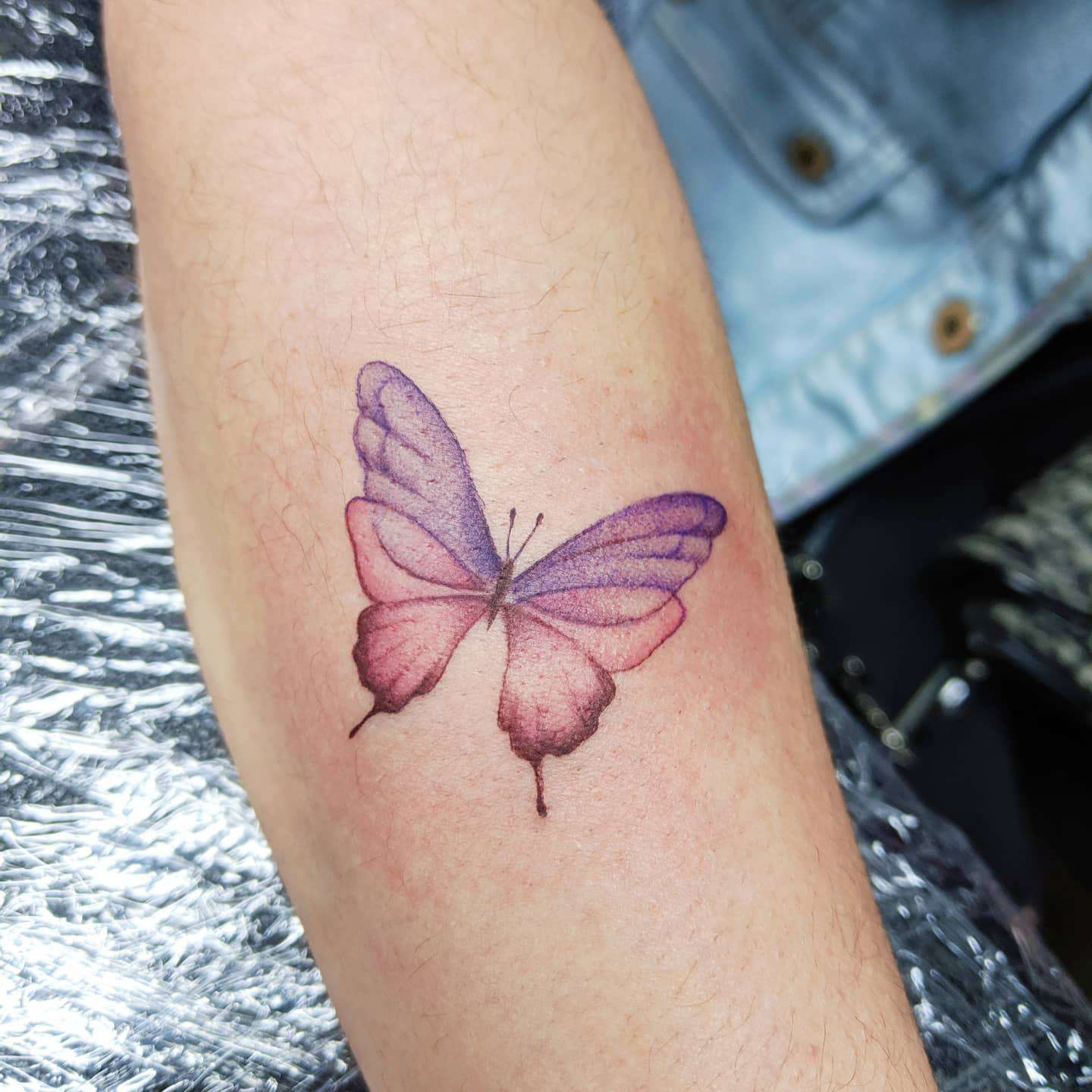 small butterfly hand tattoo for women