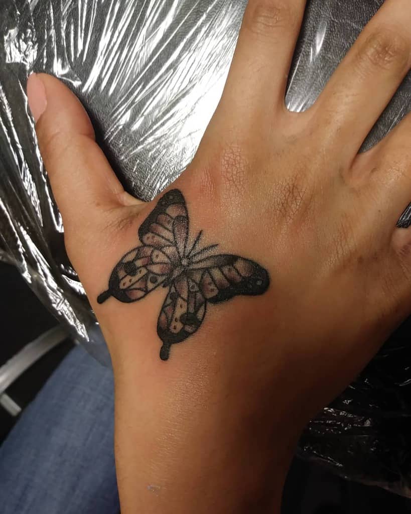 small butterfly hand tattoo 0012