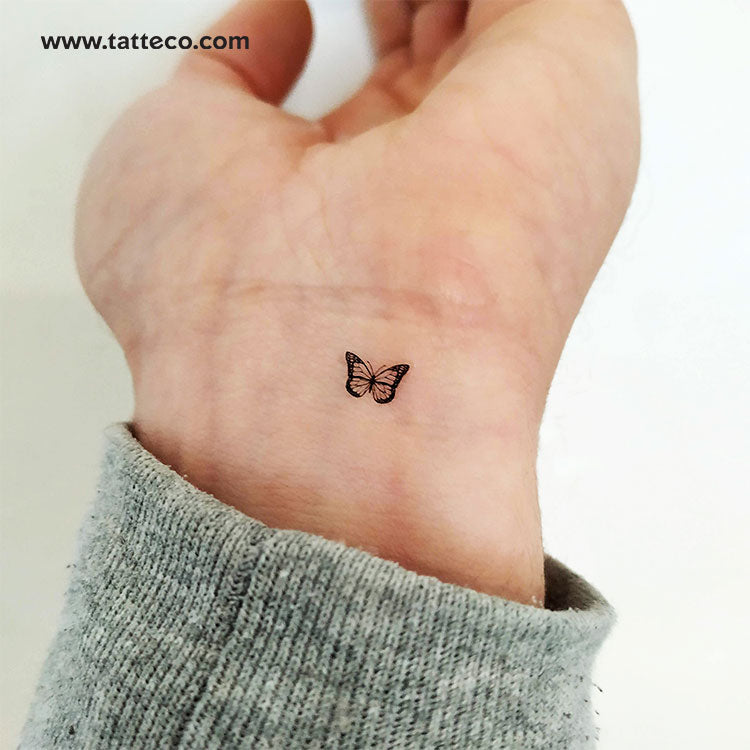 small butterfly hand tattoo 0013