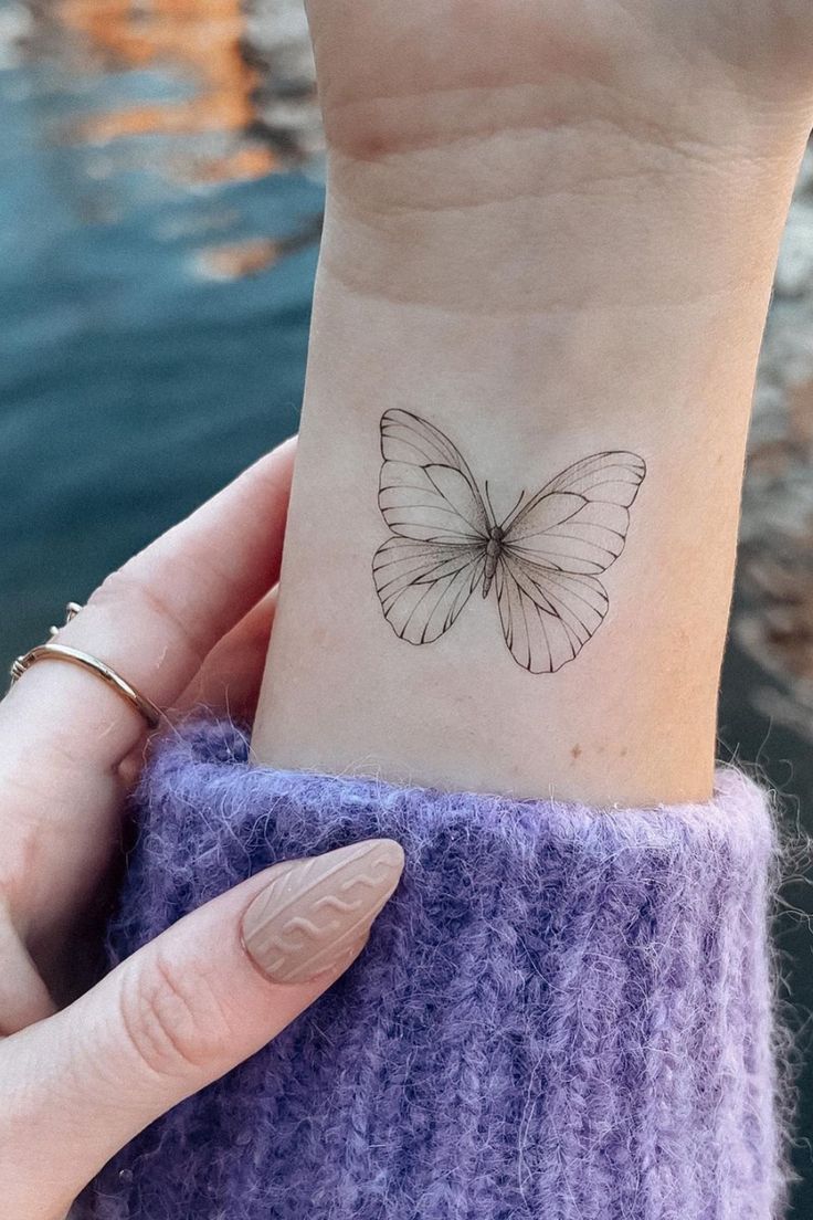 small butterfly hand tattoo 0017